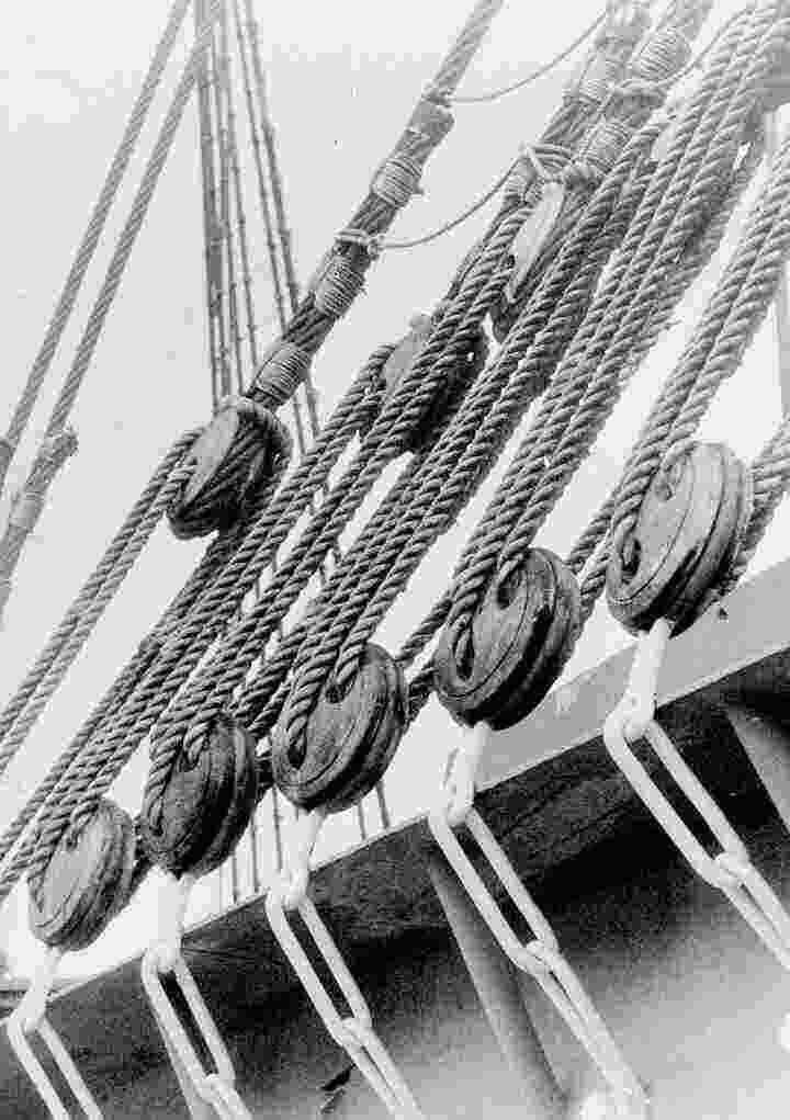 A black and white photo of a ship's rigging.