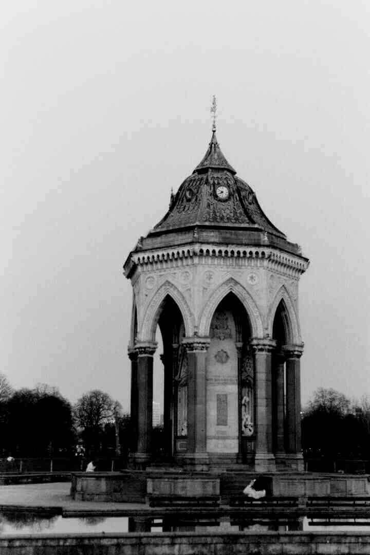 Some Victorian pavillion structure in a park.