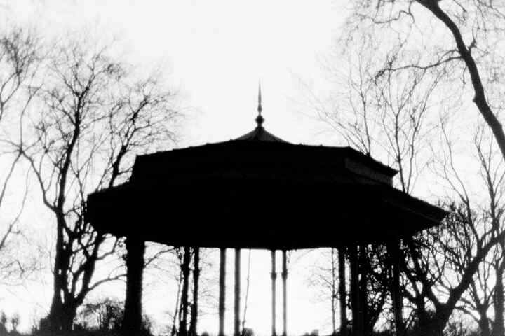 A heavily silhouetted bandstand.