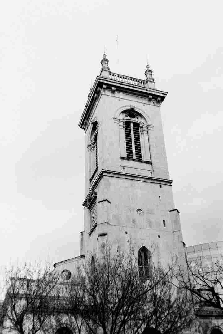 A church tower against the city sky.